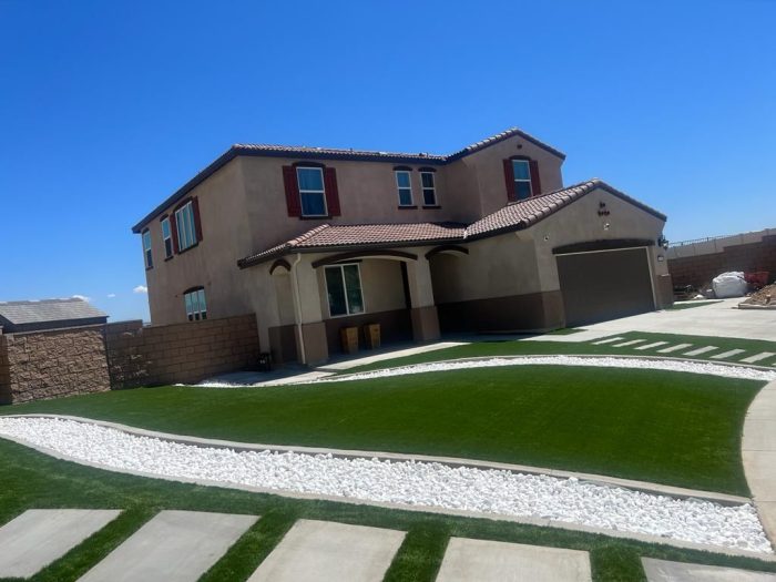 house landscape with white pebbles